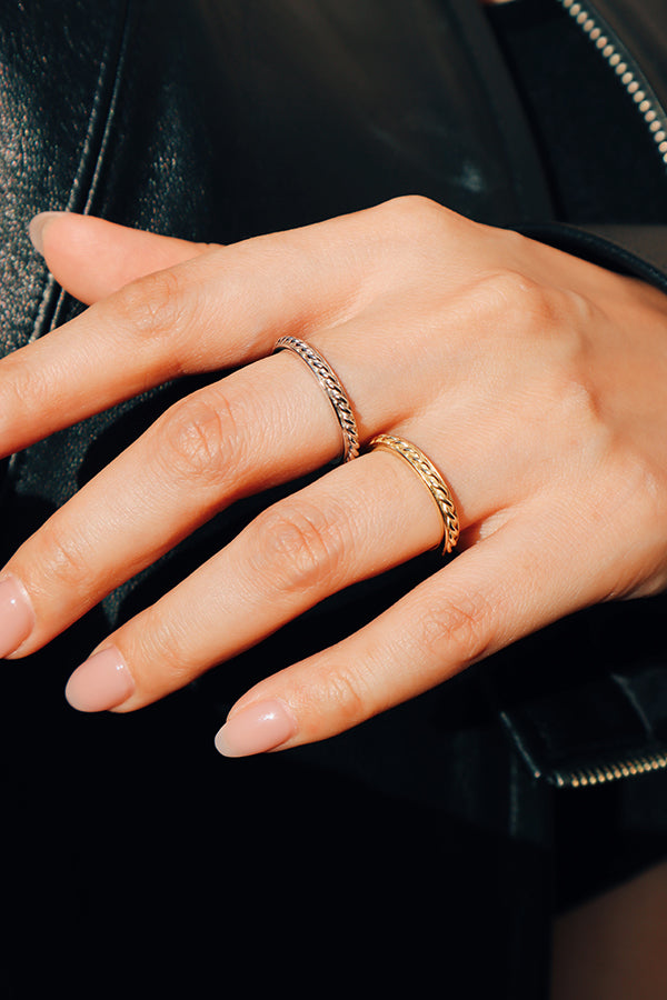 Woman style her look with gold and silver color rings