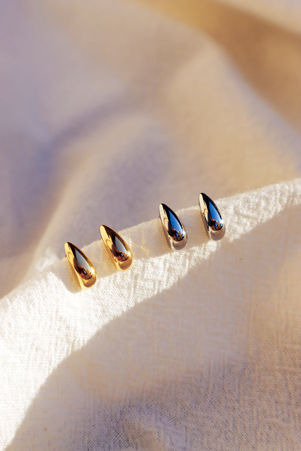 Gold and silver little dome stud earrings under the sun