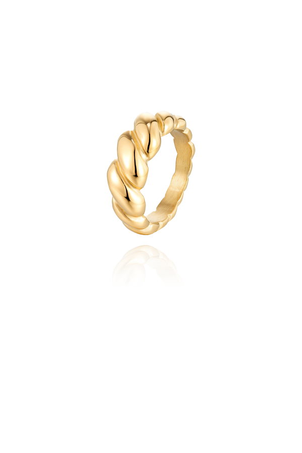 A gold croissant ring featuring a bold twisted design, showcasing its unique and textured shape against a white background.