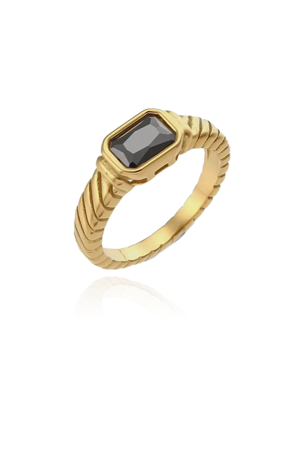 A striking gold-plated ring showcasing a rectangular-cut black cubic zirconia gemstone. The band features a distinct textured design, resembling a twisted rope, which enhances the overall allure of the ring. The deep, dark stone contrasts beautifully with the gold setting, creating a bold statement piece perfect for adding an edge to your ensemble.