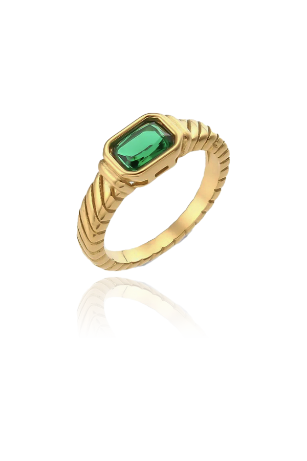 A captivating gold-plated ring with a vibrant rectangular-cut green cubic zirconia gemstone. The band is intricately designed with a twisted rope pattern, adding a unique flair to the piece. The lush green stone is encased in a smooth bezel setting, making this ring an eye-catching addition to your jewelry collection, ideal for adding a pop of color to any look.