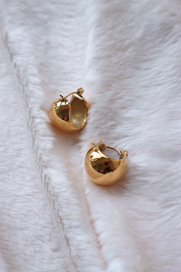 18K gold plated hoops on the white cloth