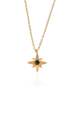 Essie star necklace with green cubic zirconia, displayed on a white background.