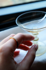 Female's left hand wearing the dyad slim ring from accessory brand SH and Company