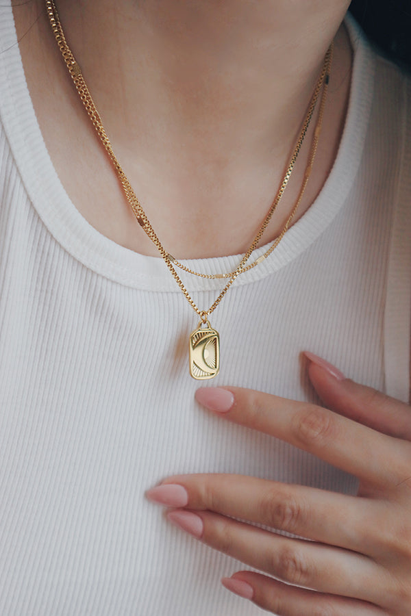 Collection of essential necklaces from SH & Co., showcasing their versatility and gold-plated elegance.