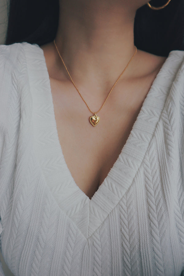 SH & Co. heart beads necklace, featuring gold heart pendants evenly spaced on a fine gold chain, ideal for versatile styling.