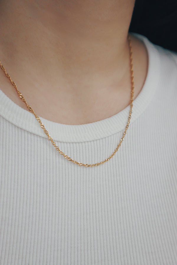 SH & Co. Singapore chain necklace, an exquisite piece with intricate link details and a polished gold finish, ideal for layering or solo wear.