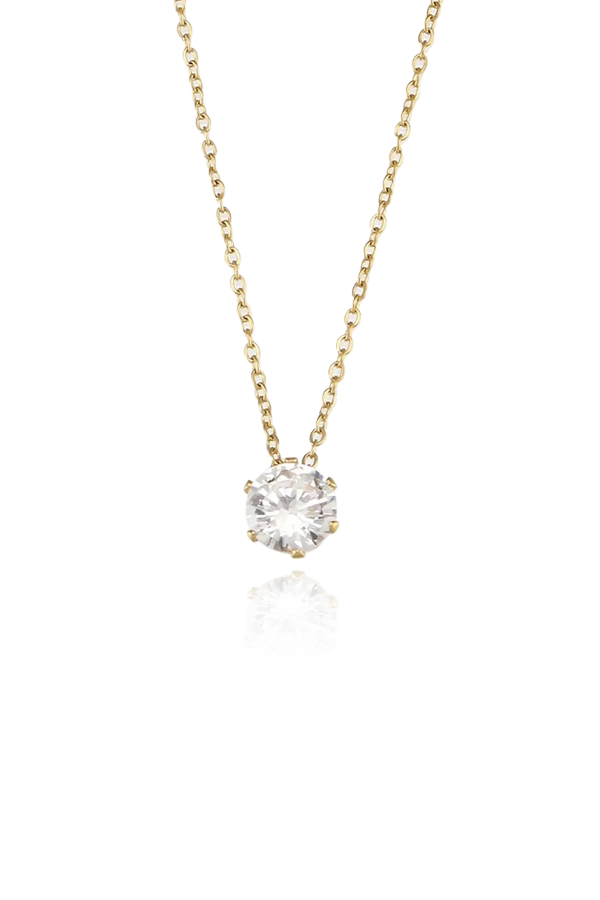 Product image of the Stella cubic zirconia solitaire necklace, featuring a single round-cut CZ stone set in a gold-plated setting, displayed on a white background.