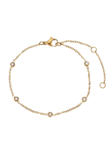 Product image of the Thaisa cubic zirconia bracelet, featuring small bezel-set stones on a delicate gold chain, displayed against a white background.