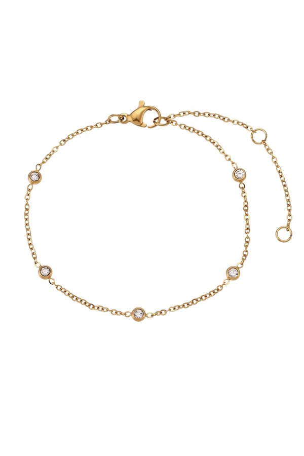 Product image of the Thaisa cubic zirconia bracelet, featuring small bezel-set stones on a delicate gold chain, displayed against a white background.